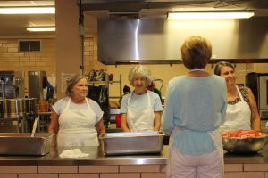 Church members on the Meals on Wheels food preparation line.